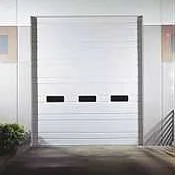 A white ribbed steel overhead door with a row of small windows.